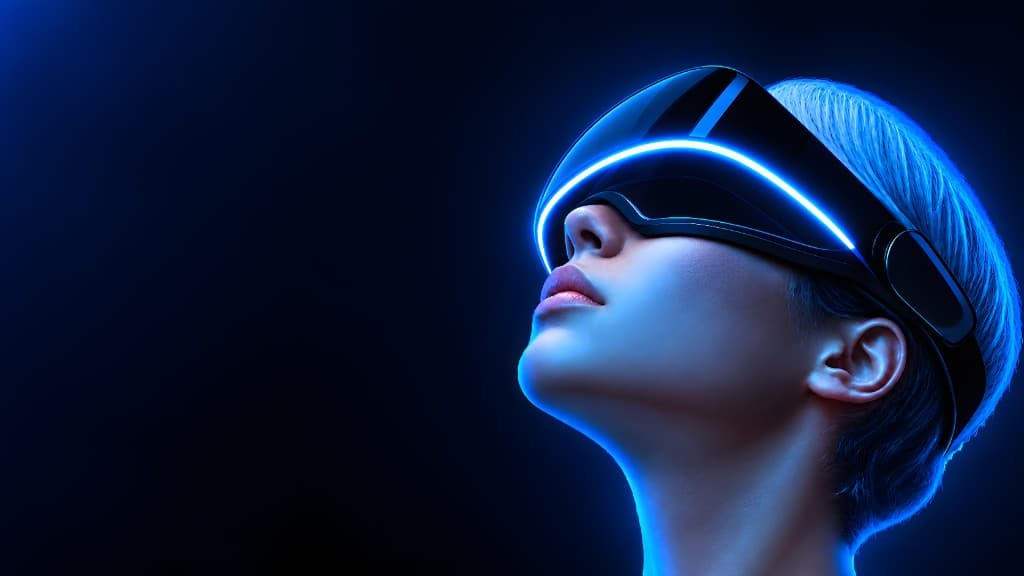 Person wearing a futuristic VR headset with blue neon glow